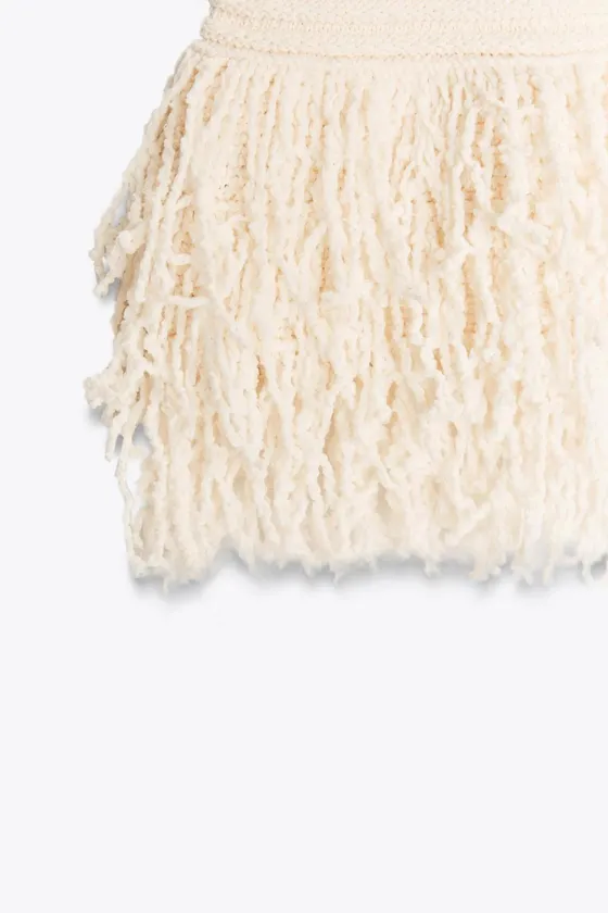 ЮБКА ИЗ РЕЛЬЕФНОГО ТРИКОТАЖА В КЛЕТКУ С БАХРОМОЙ