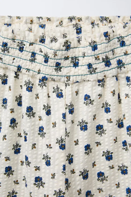 БРЮКИ С ЦВЕТОЧНЫМ ПРИНТОМ