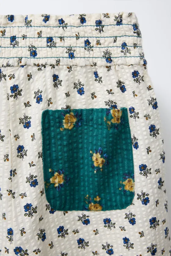 БРЮКИ С ЦВЕТОЧНЫМ ПРИНТОМ