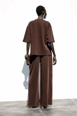 Брюки из ткани с эффектом потертости- Заказать в России