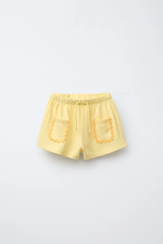 ШОРТЫ-БЕРМУДЫ С ВОЛНИСТЫМИ ДЕТАЛЯМИ CASA LAWA © X ZARA KIDS