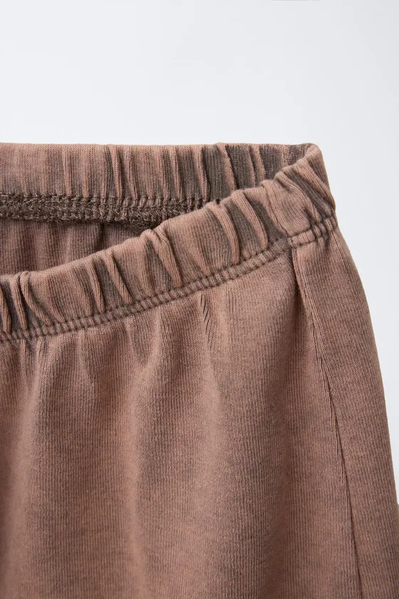 STUDDED WASHED-EFFECT BERMUDA SHORTS