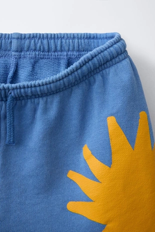 Шорты с принтом «солнце»- Заказать в России