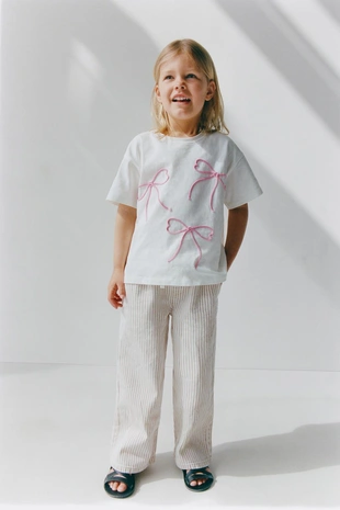 Футболка со шнуровкой и бантами- Заказать в России