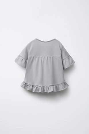 Однотонная футболка с воланами- Заказать в России