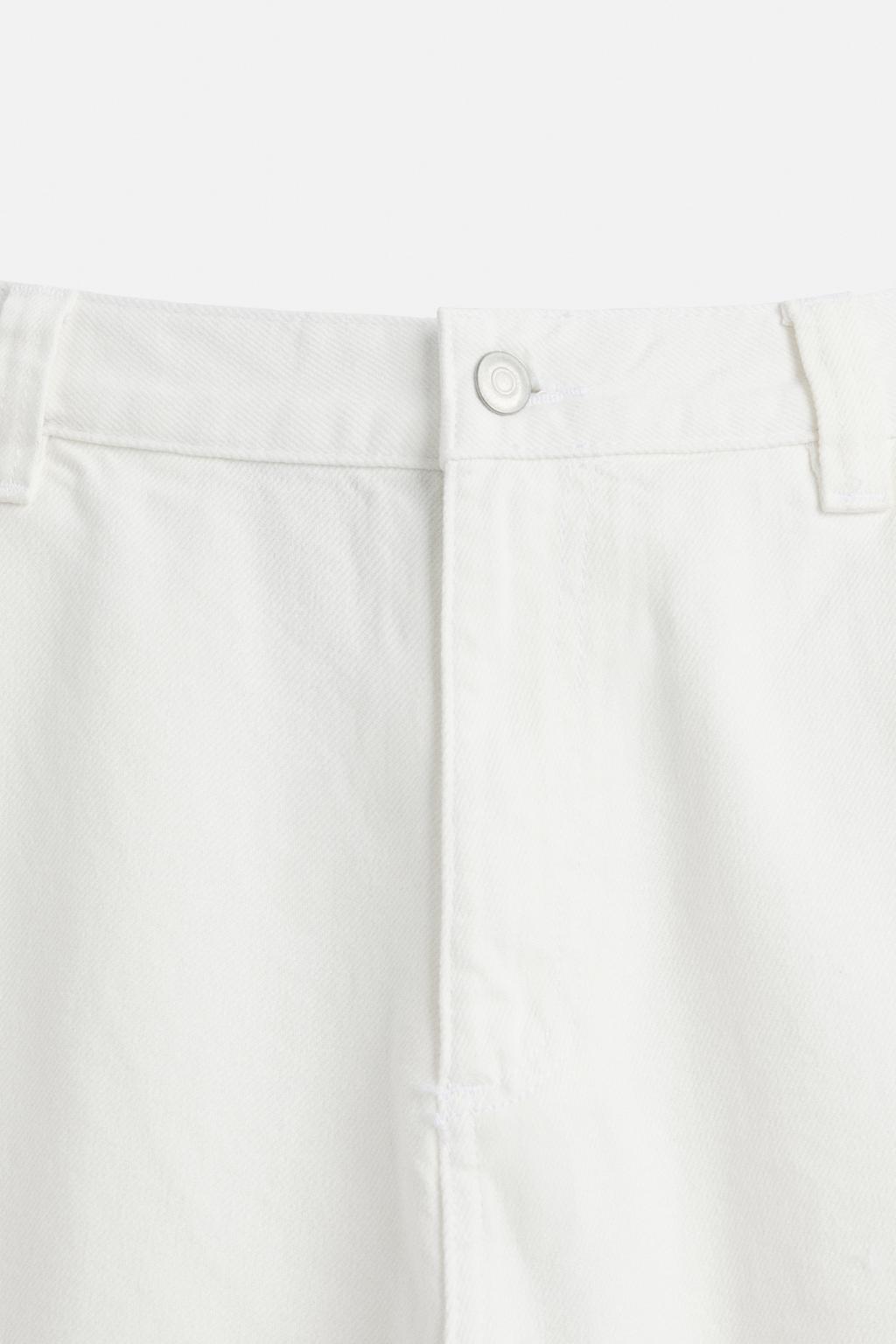 Джинсы с потертостями и карманами для плотника zara