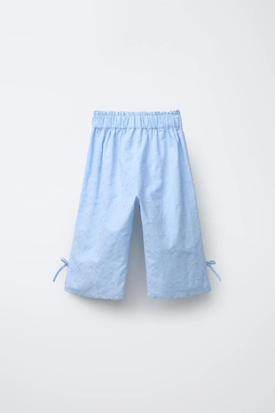 Брюки с вышивкой в виде бантов- Заказать в России