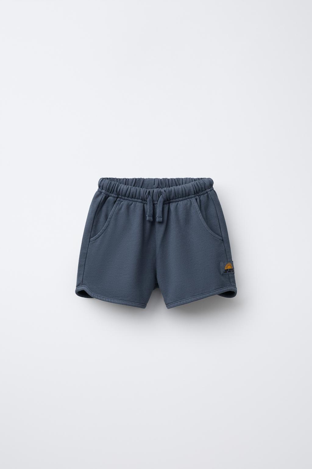 STRAIGHT FIT GARMENT-DYED PLUSH BERMUDA SHORTS WITH LABEL