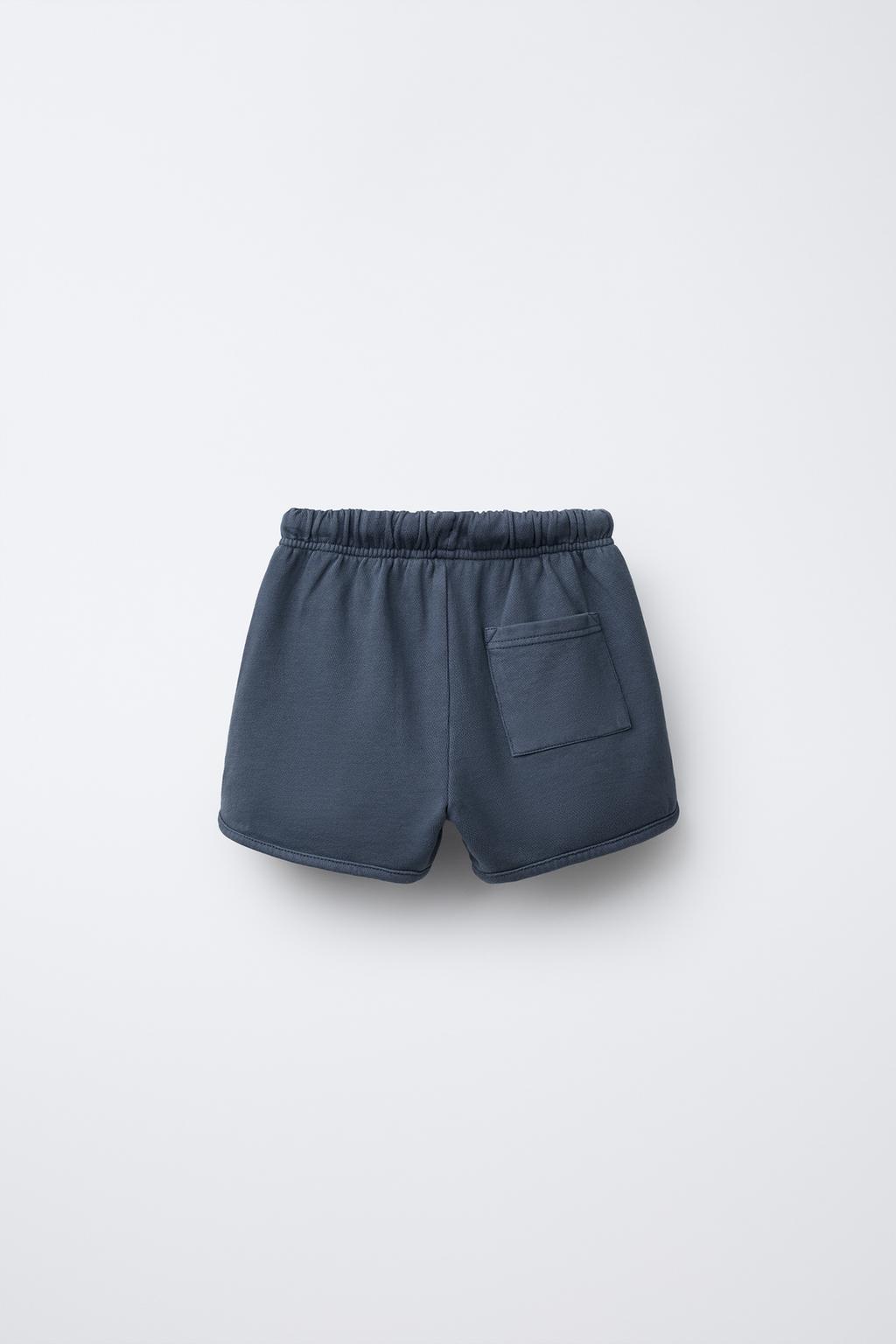 STRAIGHT FIT GARMENT-DYED PLUSH BERMUDA SHORTS WITH LABEL
