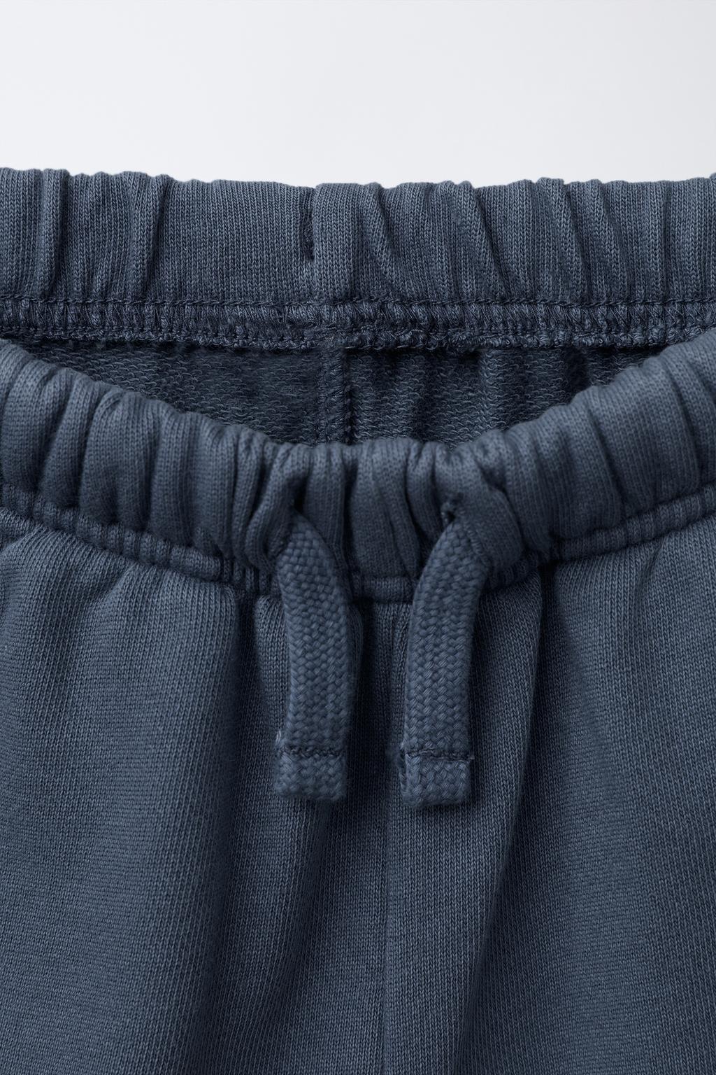STRAIGHT FIT GARMENT-DYED PLUSH BERMUDA SHORTS WITH LABEL