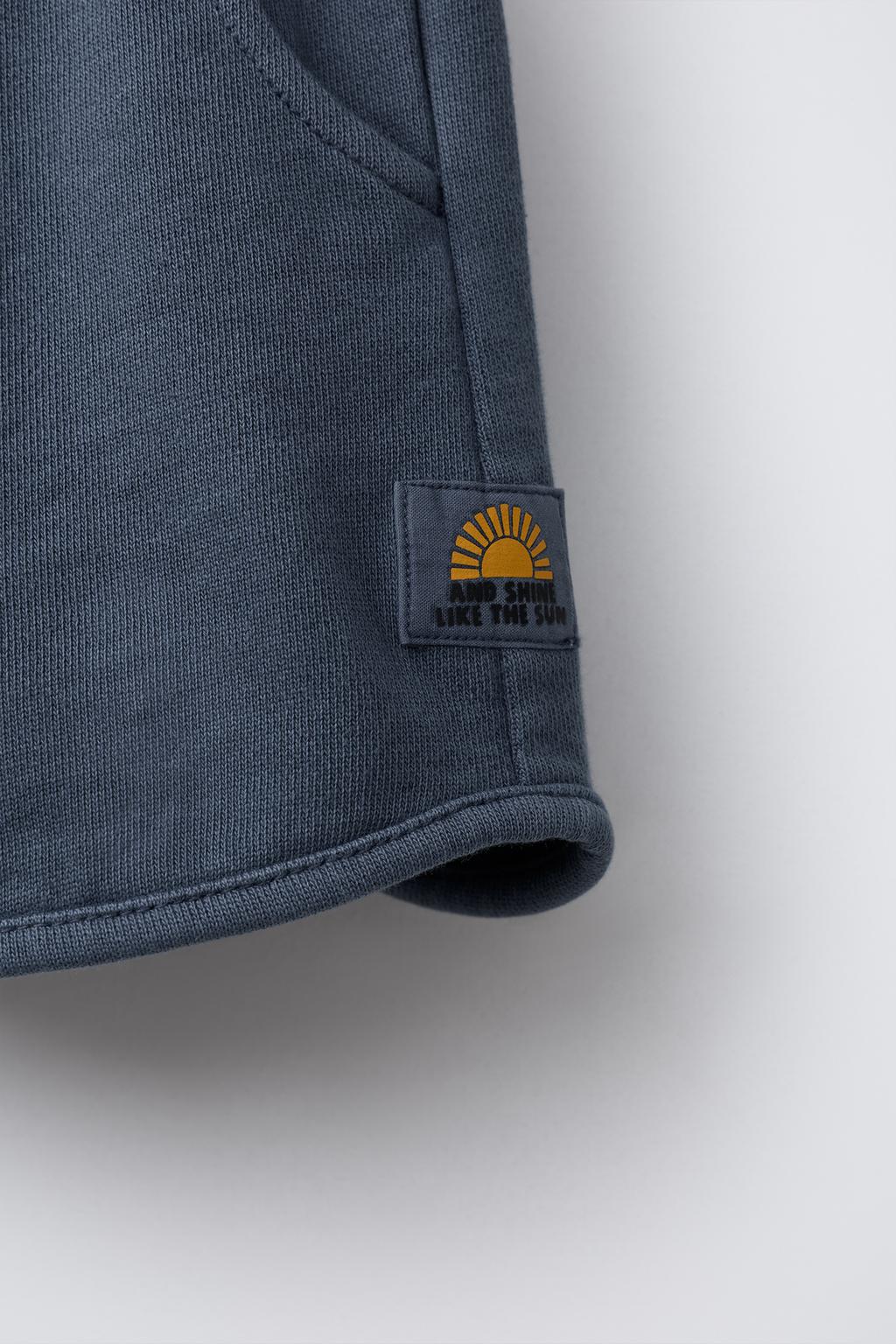 STRAIGHT FIT GARMENT-DYED PLUSH BERMUDA SHORTS WITH LABEL