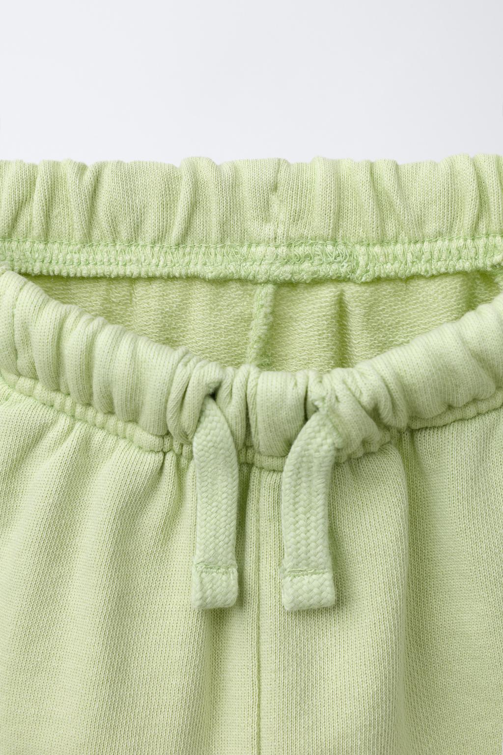 STRAIGHT FIT GARMENT-DYED PLUSH BERMUDA SHORTS WITH LABEL