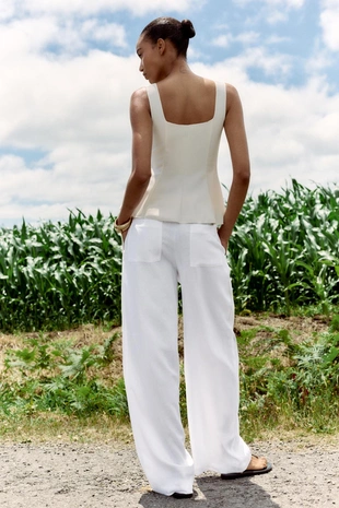 Эластичный топ-жилет с баской- Заказать в России