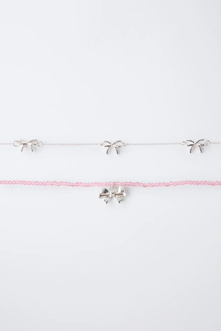 Набор из двух ожерелий с бантиками- Заказать в России