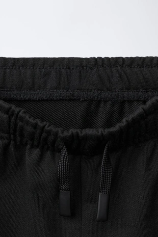 Комбинированные брюки-джоггеры из вафельной ткани- Заказать в России