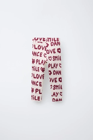 Легинсы в рубчик с принтом