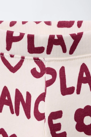 Легинсы в рубчик с принтом