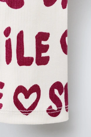 Легинсы в рубчик с принтом