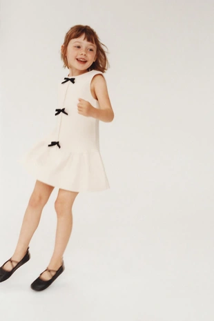 Трикотажное платье с бантиками- Заказать в России