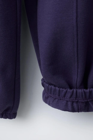 Брюки-джоггеры из мягкой ткани с вышивкой- Заказать в России