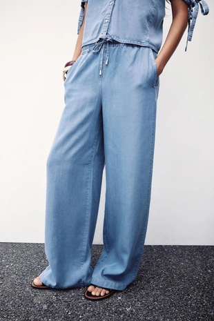 Брюки с широкими штанинами и эластичным поясом- Заказать в России