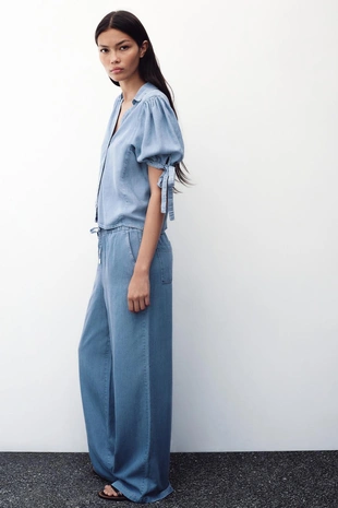 Брюки с широкими штанинами и эластичным поясом- Заказать в России