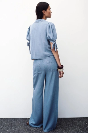 Брюки с широкими штанинами и эластичным поясом- Заказать в России