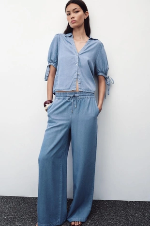 Брюки с широкими штанинами и эластичным поясом- Заказать в России