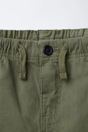 Брюки из эластичной рельефной ткани- Заказать в России