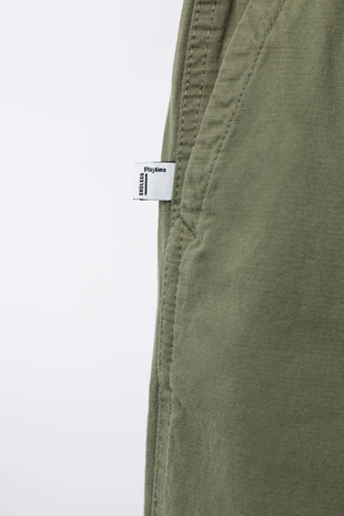 Брюки из эластичной рельефной ткани- Заказать в России