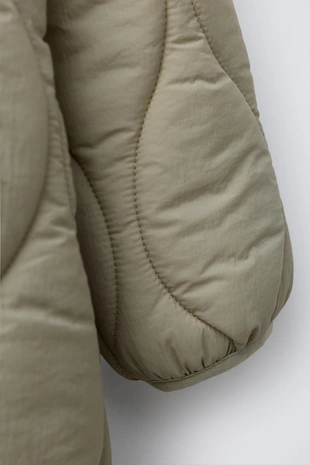 Длинный стеганый комбинезон- Заказать в России