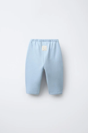 Брюки BAGGY из мягкой ткани с нашивкой - Заказать в России