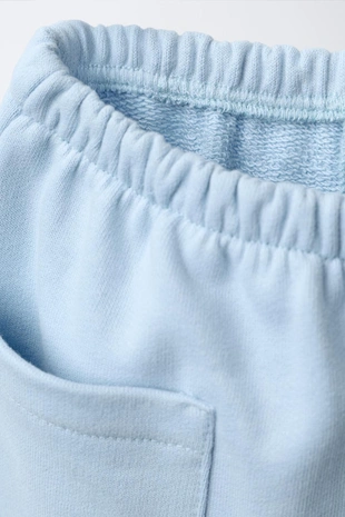 Брюки BAGGY из мягкой ткани с нашивкой - Заказать в России