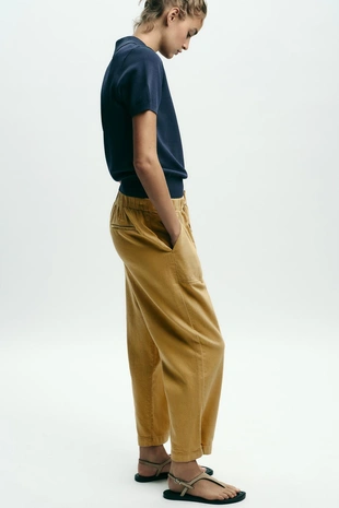 Брюки-джоггеры с застежкой на кнопку снизу- Заказать в России