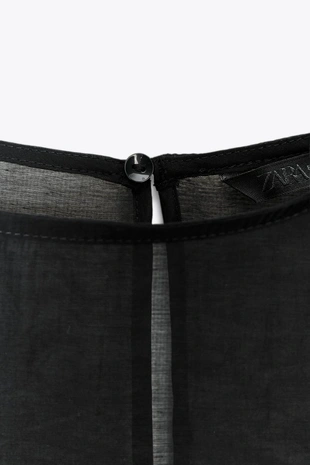 Полупрозрачная блузка с воланами