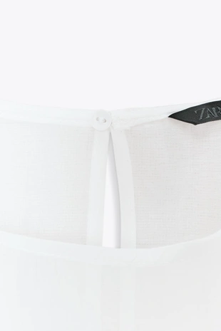 Полупрозрачная блузка с воланами- Заказать в России