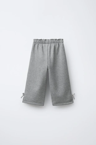 Брюки флисовые с блестящими бантами- Заказать в России