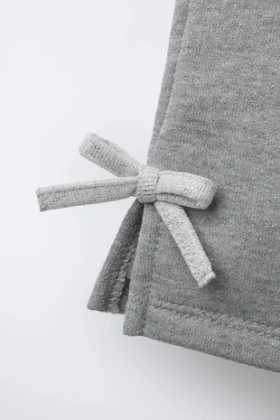 Брюки флисовые с блестящими бантами- Заказать в России