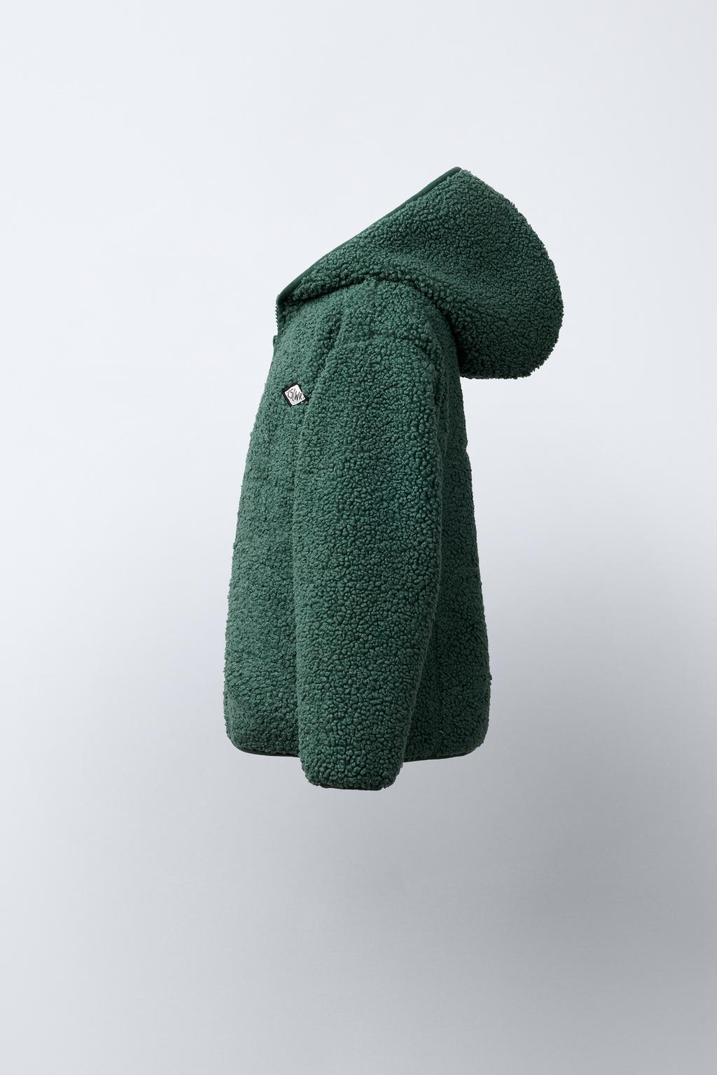 КУРТКА ИЗ ИСКУССТВЕННОЙ ОВЧИНЫ С КАПЮШОНОМ