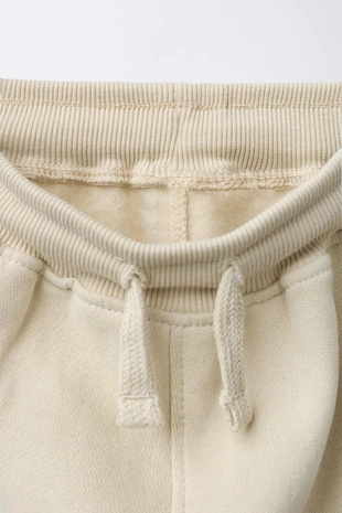 Брюки-джоггеры с логотипом и флоковым покрытием- Заказать в России