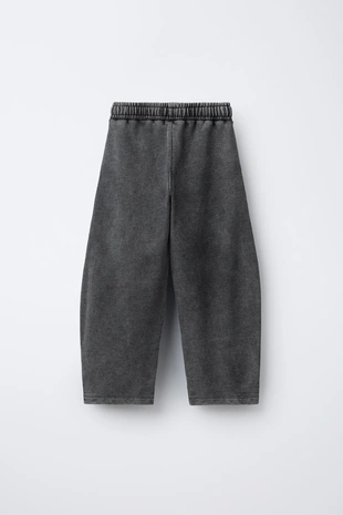 Брюки оверсайз с эффектом потертости- Заказать в России