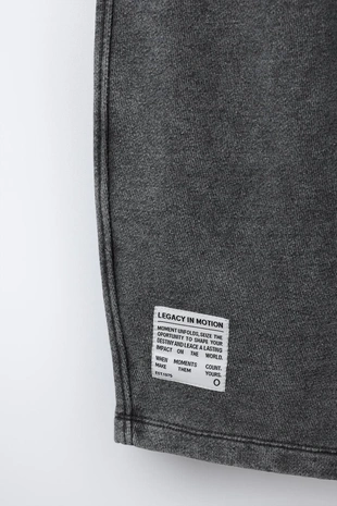 Брюки оверсайз с эффектом потертости- Заказать в России