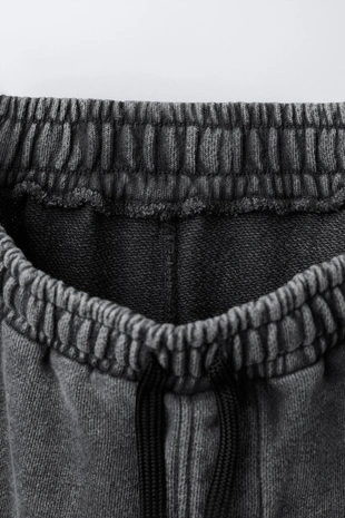 Брюки оверсайз с эффектом потертости- Заказать в России