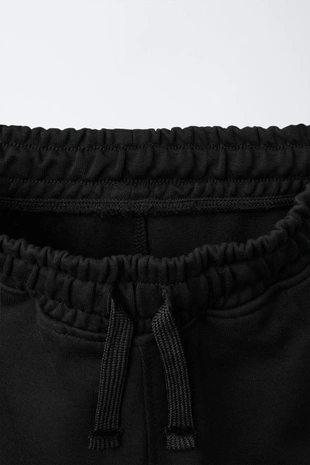 Брюки-джоггеры с вставками из пике- Заказать в России