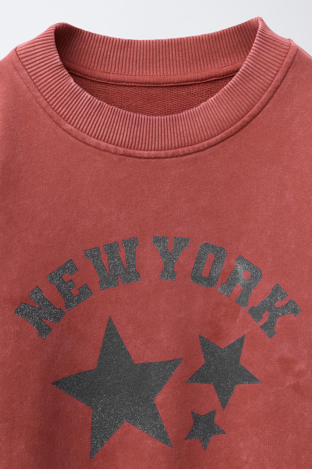 WASHED EFFECT SWEATSHIRT WITH SHINY STARS