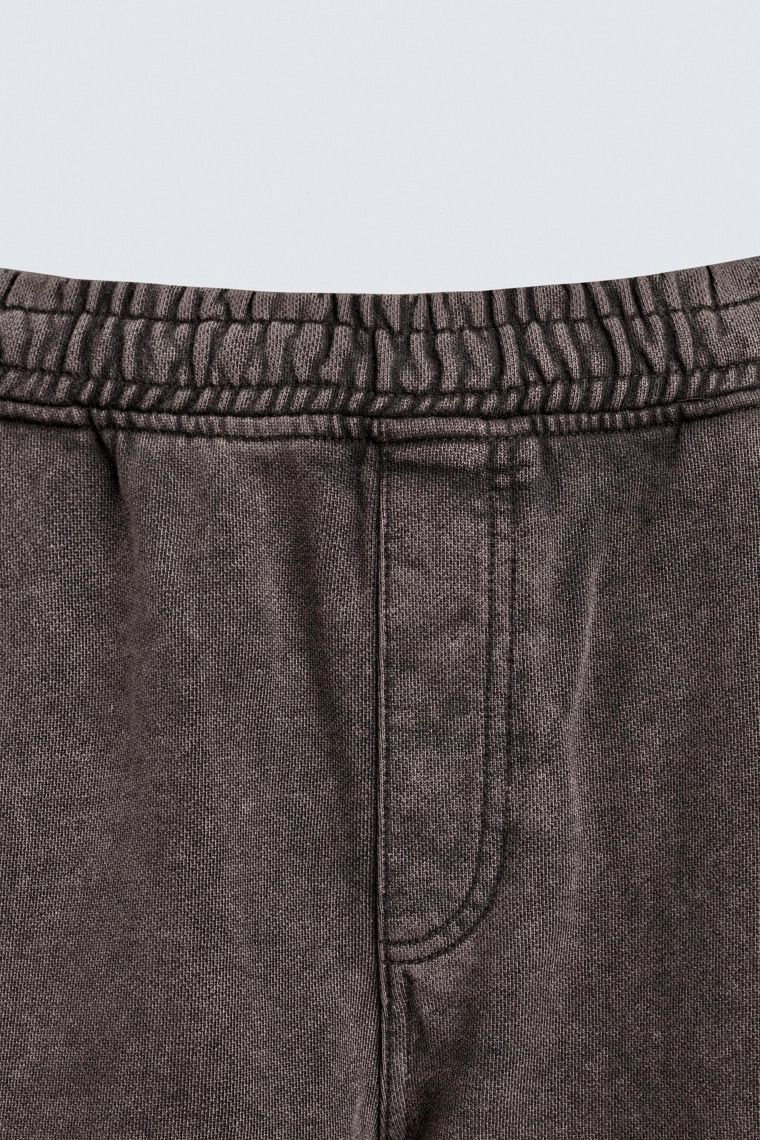 Джоггеры в свободном крое с эффектом потертости