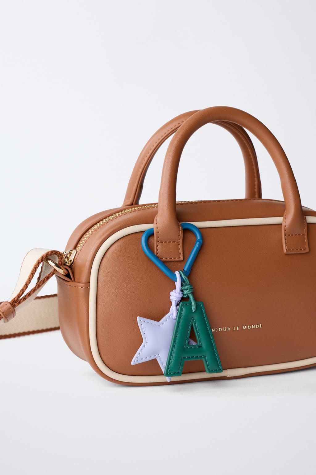 Сумка charm crossbody