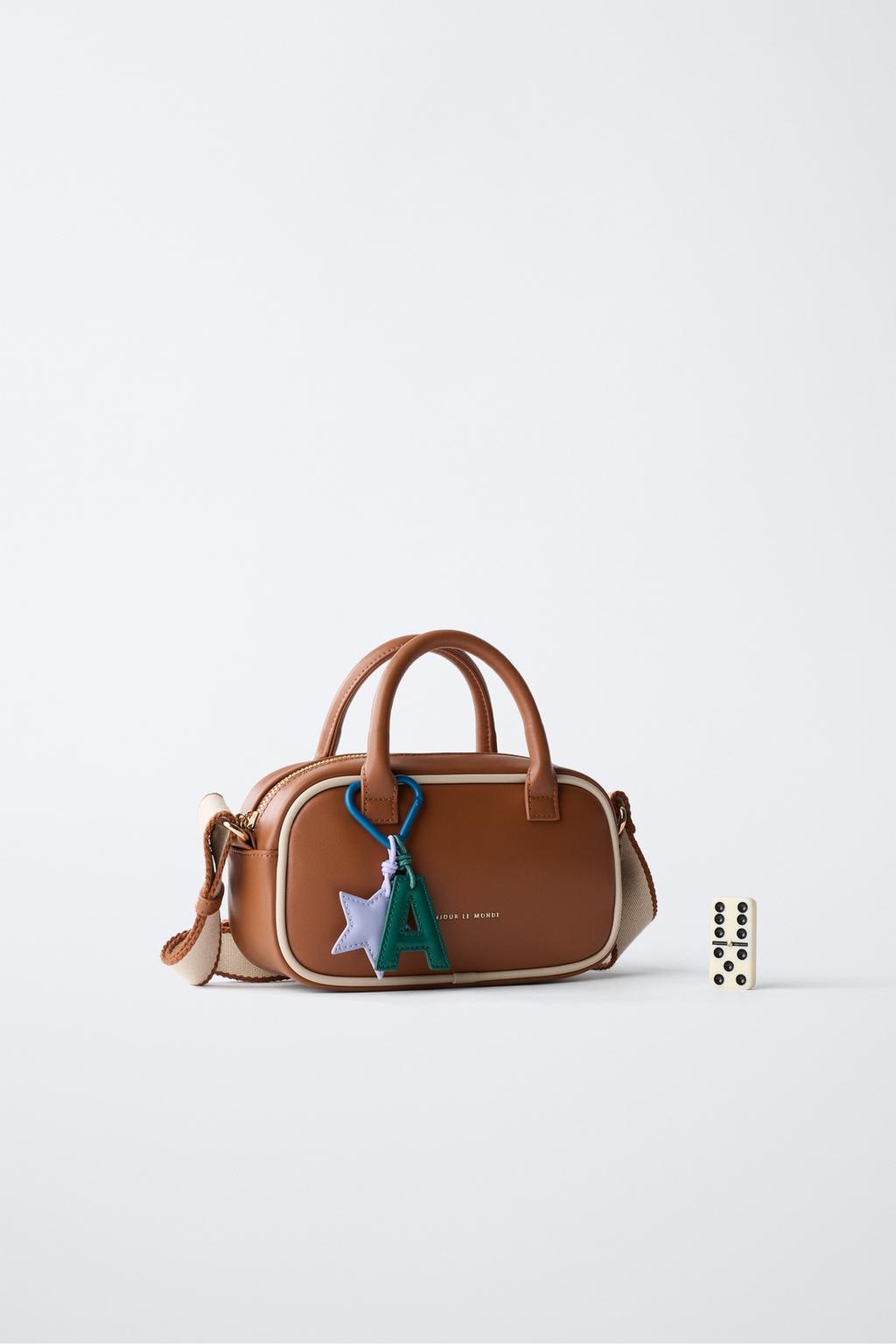 Сумка charm crossbody