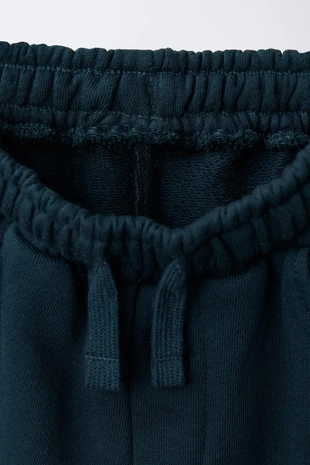 Трикотажные брюки-джоггеры с надписью- Заказать в России