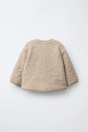 Куртка из искусственной овчины с застежкой на пуговицы- Заказать в России